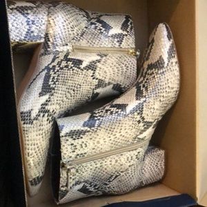 Cole han snake print boots size 9. They fit more like an 8.5